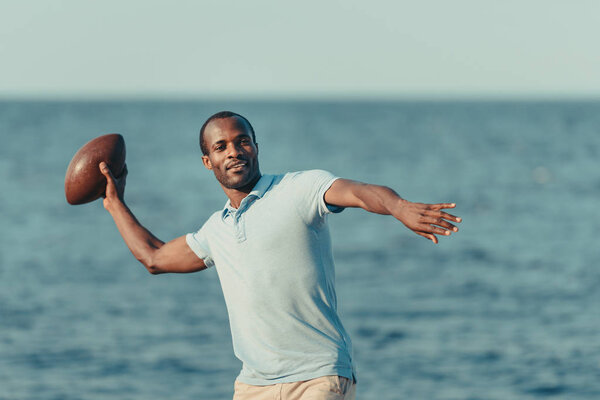 african american man with rugby ball