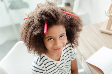 Little girl with markers in hair clipart
