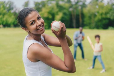 african american woman with baseball ball clipart