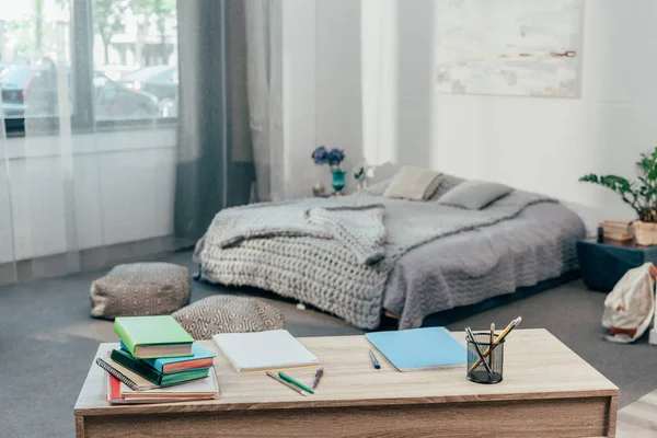 Desk with school supplies and books — Stock Photo, Image