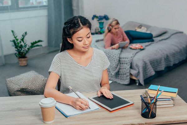 asian woman studying at home