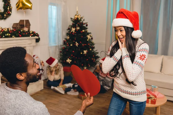 Multicultural couple on christams eve — Stock Photo, Image