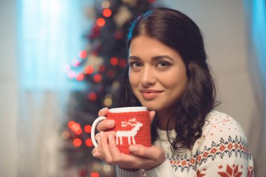 young woman with hot drink clipart