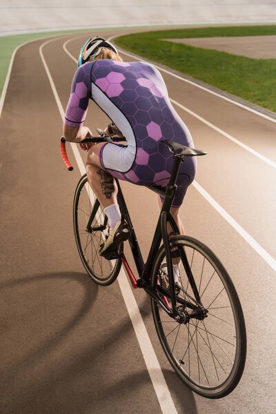 cyclist riding bicycle on cycle race track