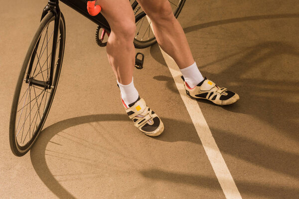 cyclist standing near bicycle