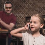 Daughter talking by smartphone