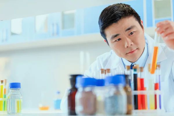 Asian doctor working at testing laboratory — Stock Photo