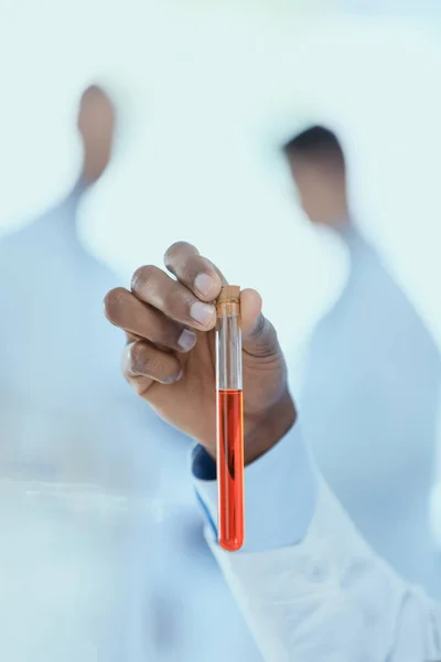 Scientist holding test tube — Stock Photo