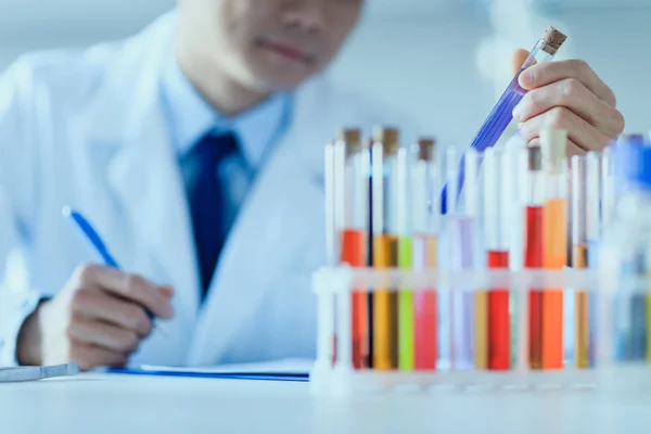 Scientist holding test tube — Stock Photo