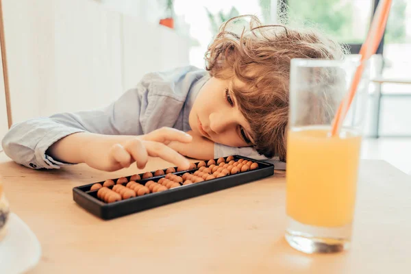 Boy with vintage counting tool — Stock Photo