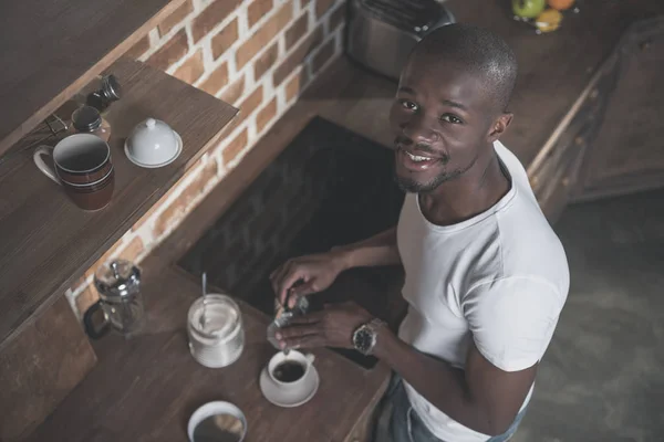 African american man preparing coffee — Stock Photo
