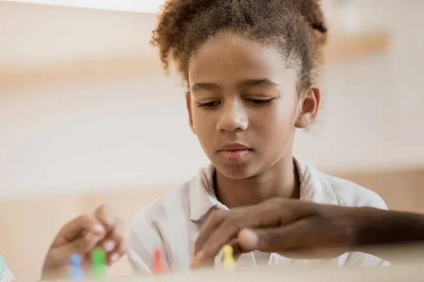 Girl playing board game — Stock Photo