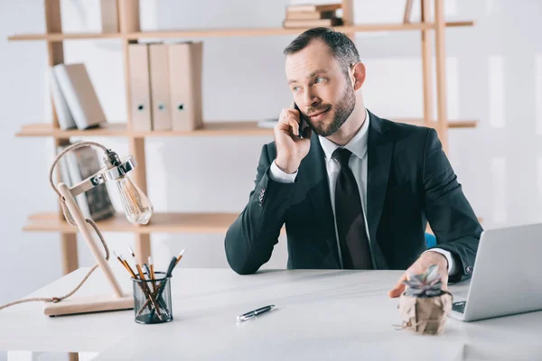 Businessman talking by phone — Stock Photo