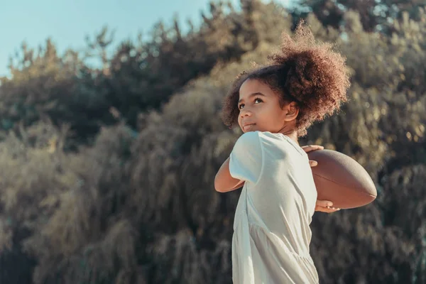 African american child with ball on beach — Stock Photo