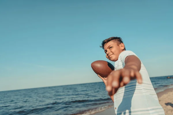 African american child with ball on beach — Stock Photo