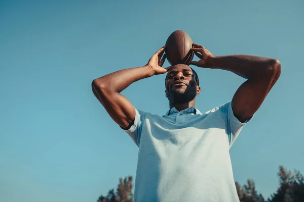 African american man with rugby ball — Stock Photo