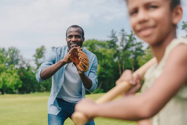 African american family playing baseball — Stock Photo