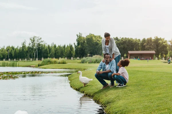 African american family near lake — Stock Photo