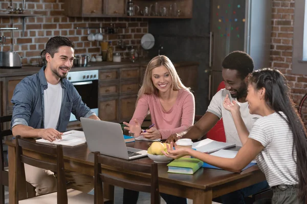 Students studying at home on kitchen — Stock Photo