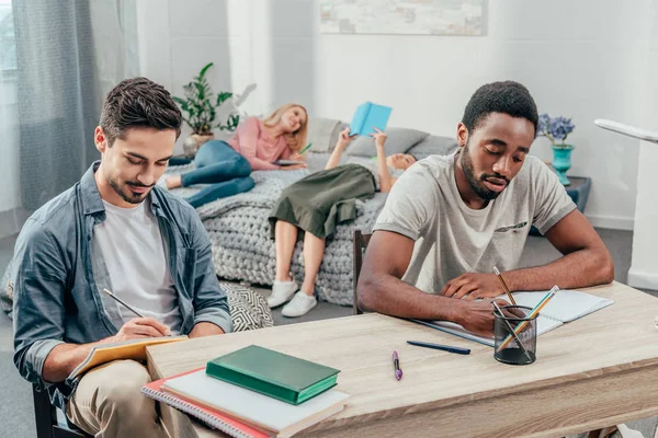 Students studying at home — Stock Photo