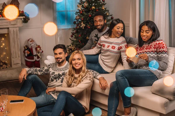 Multicultural friends on christmas eve — Stock Photo