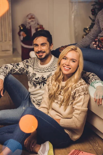 Smiling couple on christmas eve — Stock Photo