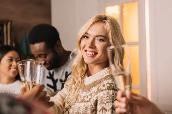 Smiling woman with glass of champagne — Stock Photo