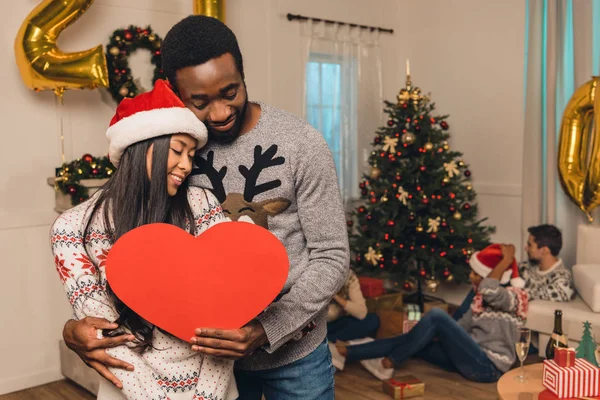 Multicultural couple on christams eve — Stock Photo