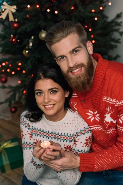 Happy couple with candle — Stock Photo