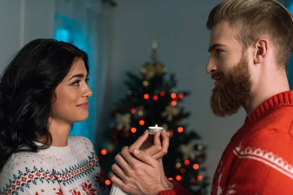 Happy couple with candle — Stock Photo