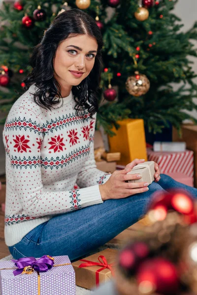 Woman with christmas gifts — Stock Photo