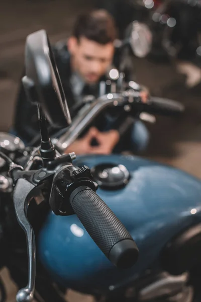 Classic motorcycle in workshop — Stock Photo