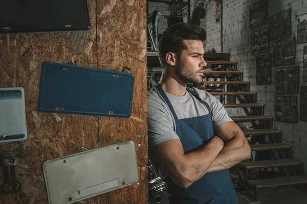 Mechanic with crossed arms — Stock Photo