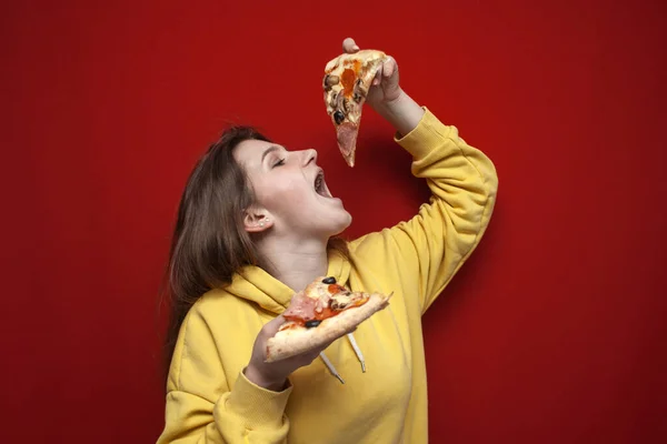 Young Happy Girl Eating Pizza Colored Background Teenager Holds Two — Stock Photo, Image