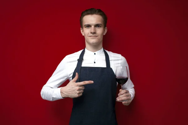 Young Professional Sommelier Offers Glass Red Tasty Wine Red Background — Stock Photo, Image