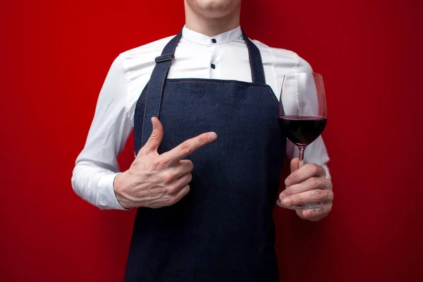 Waiter Uniform Points Finger Glass Red Wine Red Background Close — Stock Photo, Image