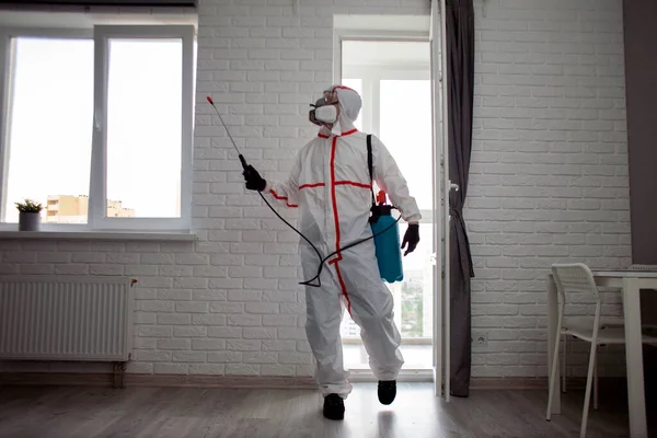 Man Protective Suit Cleans Apartment Infections Chemical Agent Sanitary Work — Stock Photo, Image