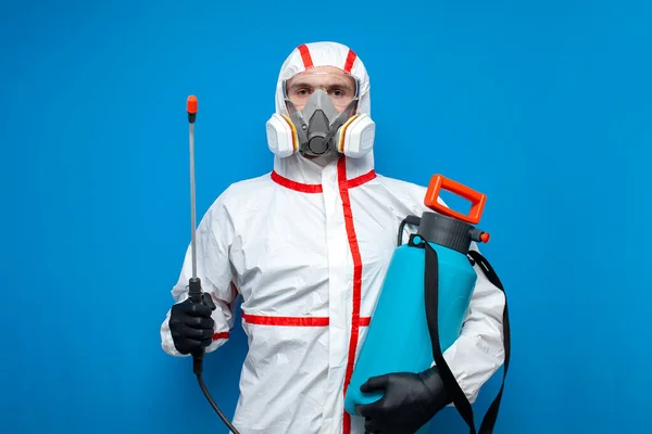 Portrait Worker Chemical Protective Suit Spray Gun Blue Isolated Background — Stock Photo, Image