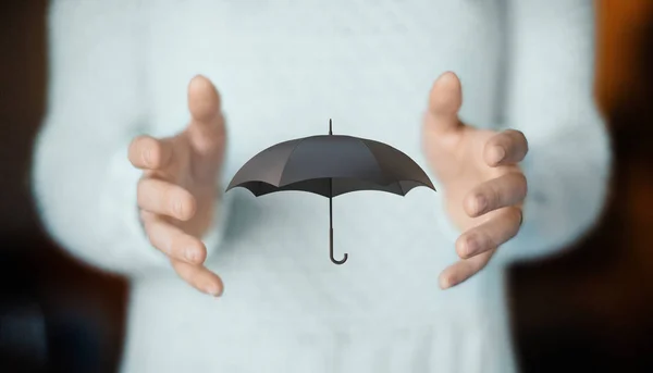 Umbrella on hands, concept of insurance or rain