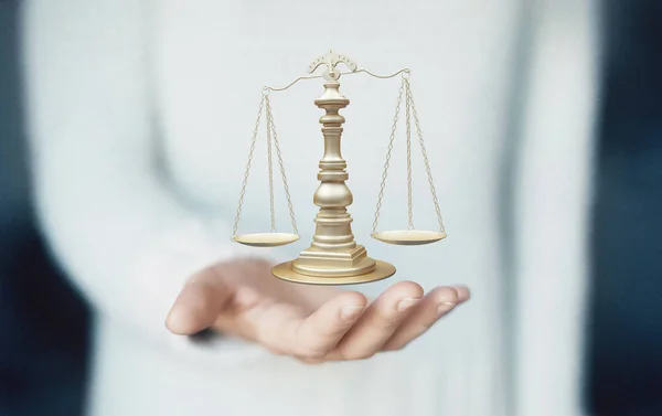 Scales of justice, weight of justice on hand, law