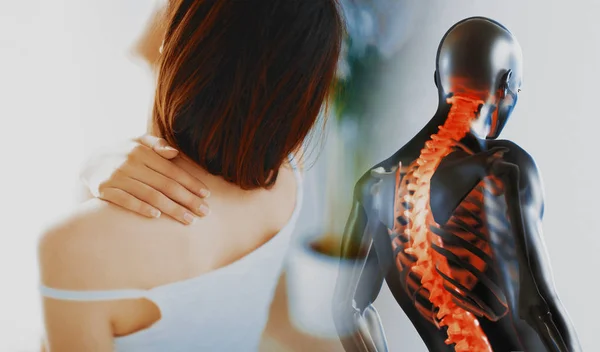 Close up of a brunette woman massaging her neck in a bedroom — 스톡 사진