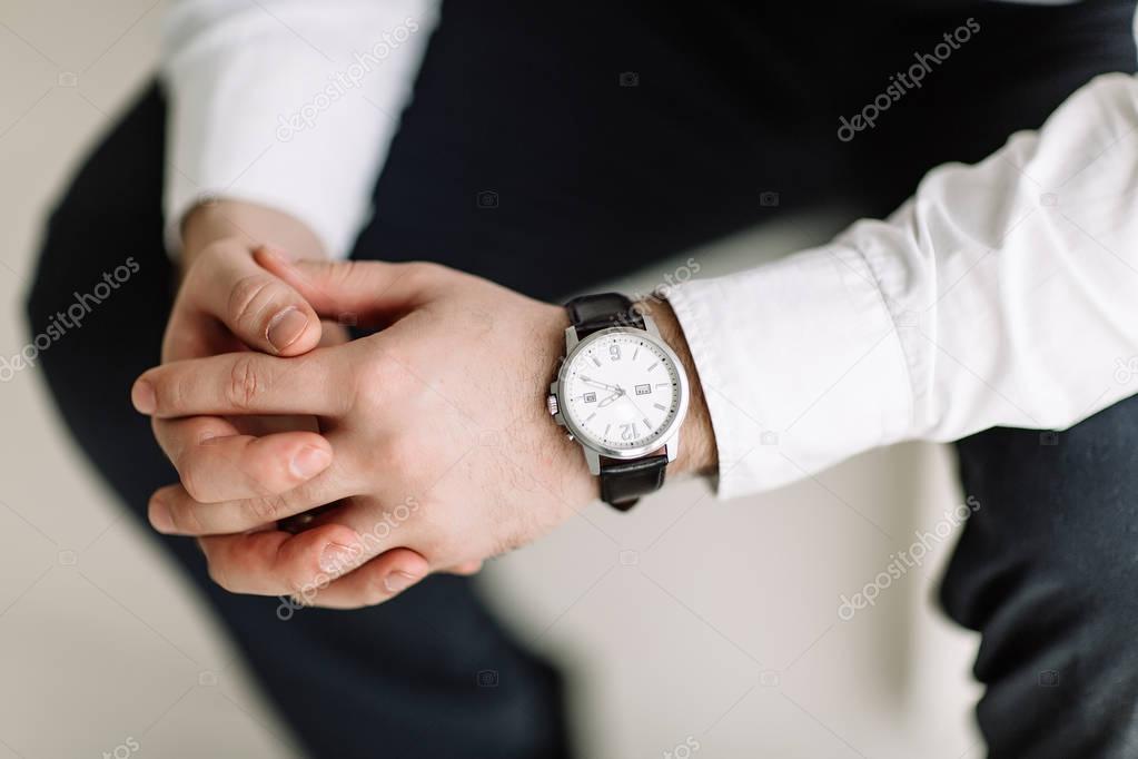 watch with white dial on the hand