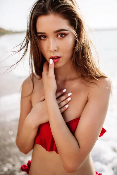 Sexy girl of Asian appearance in her swimsuit on the sea with sand, fashion — Stock Photo, Image