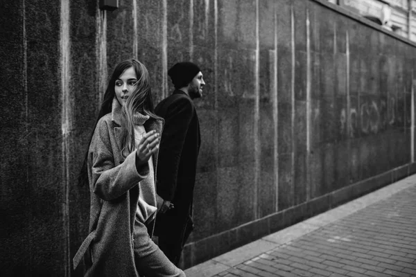 Beautiful couple in stylish clothes in gray tones, city — Stock Photo, Image