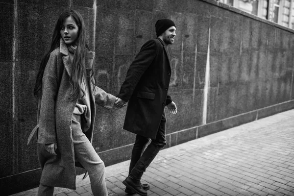 Beautiful couple in stylish clothes in gray tones, city — Stock Photo, Image