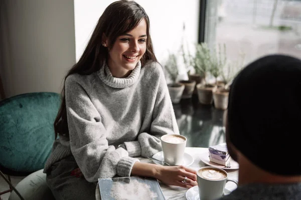 Two cheerful young loving people who drank coffee at coffee shops — Stock Photo, Image