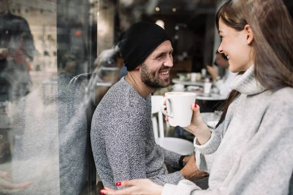 Two cheerful young loving people who drank coffee at coffee shops — Stock Photo, Image