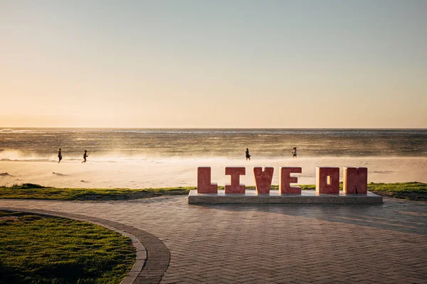 Live on large letters art installation in Camp\'s bay Cape town. Motivational and inspirational life will go on.