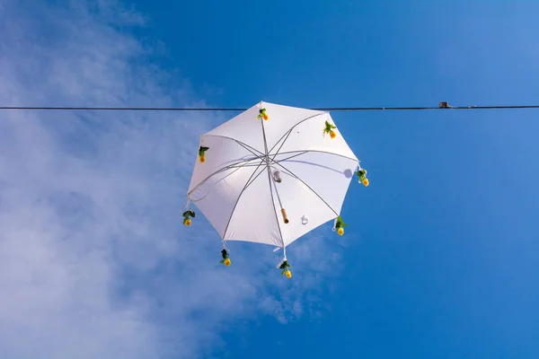 Umbrella lighting with blue sky background