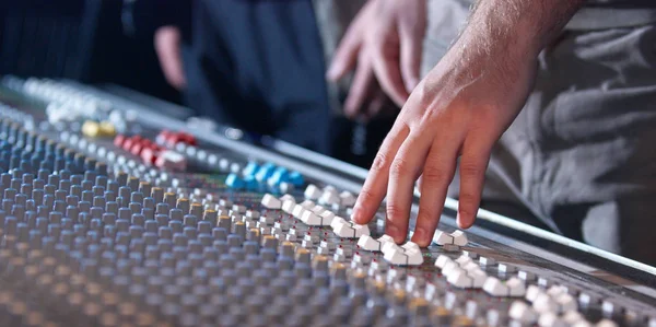 Hand of dj on the soundmixer in the nightclub — Stock Photo, Image